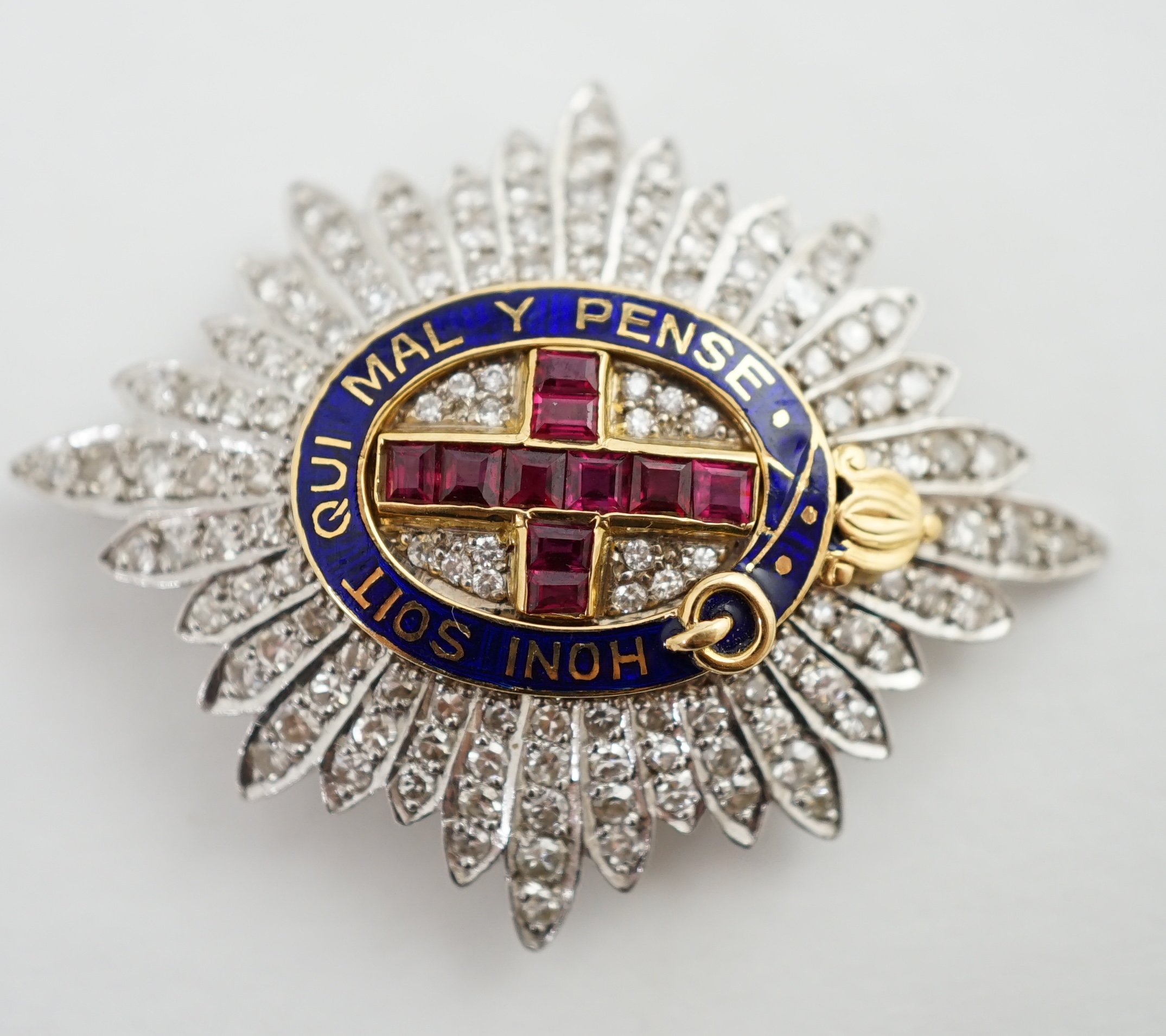 An 18ct gold, platinum, diamond, enamel and ruby Order of the Garter brooch